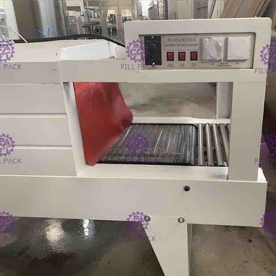 Machine à emballer semi automatique de bouteille de rétrécissement pour la bouteille en plastique de petite capacité